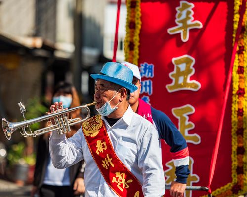 Free Musician playing trumpet in a traditional Taiwanese street parade. Stock Photo