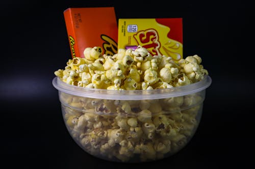 Free Popcorn in Clear Plastic Container Stock Photo