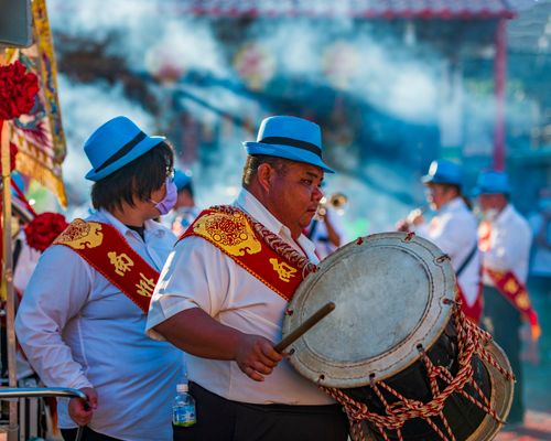 Free Colorful street parade in Taiwan featuring musicians in traditional attire and percussion instruments. Stock Photo
