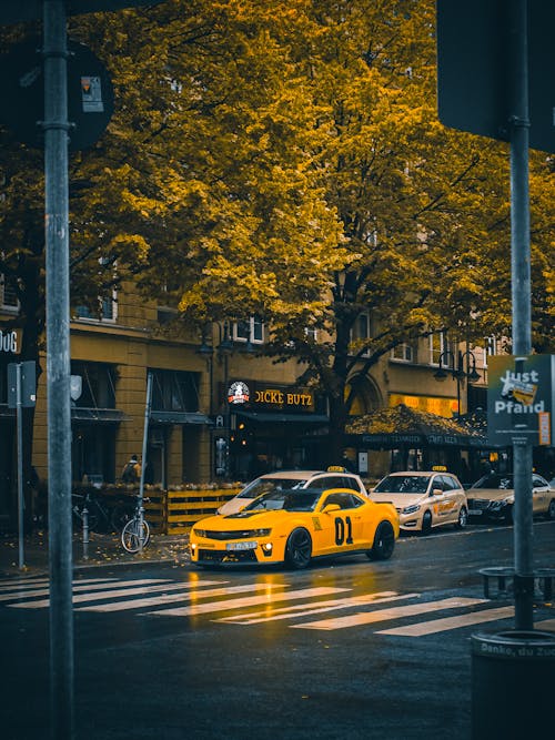 Yellow Chevrolet Camaro on a City Street