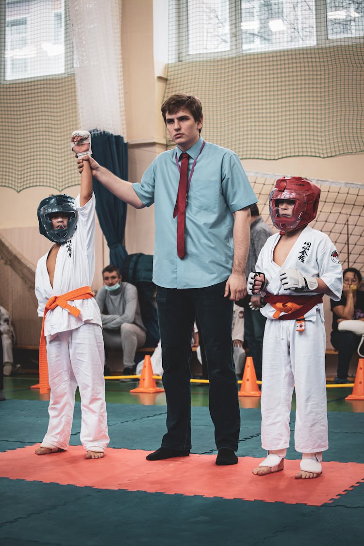 Man Announcing The Winner Of A Competition On Martial Arts 