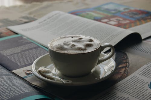 White Ceramic Mug on White Ceramic Saucer