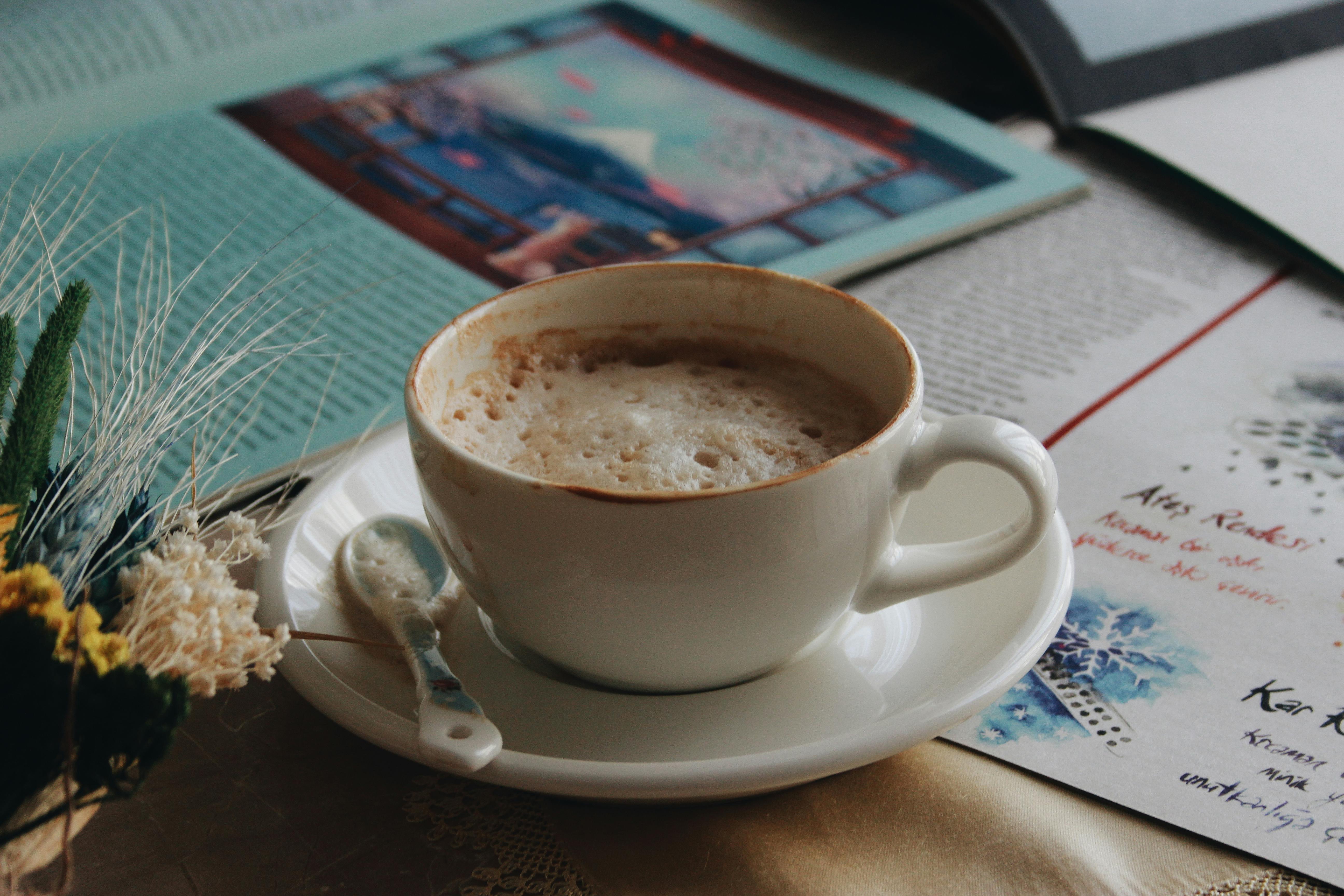 Cardamom latte in a soft-lit back booth on Garosu-gil