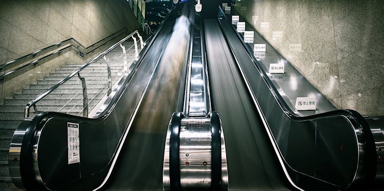 Photography Of Escalator And Stairs