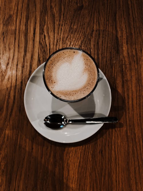 Free Close-Up Shot of a Cup of Cappuccino on a Saucer Stock Photo