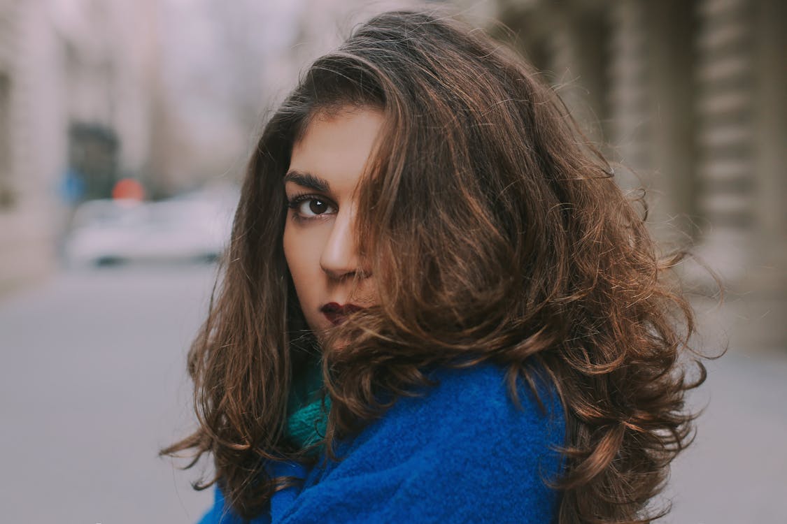 Focus Photo Of Woman In Blue Top