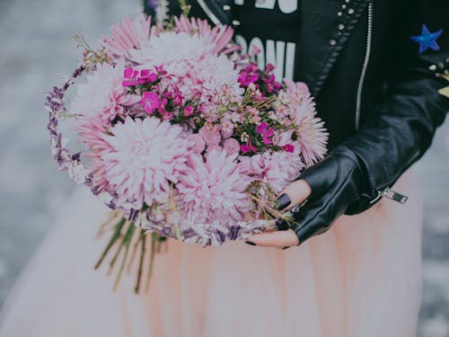 Free Person in Black Leather Jacket Pink and Red Flower Bouquet Stock Photo