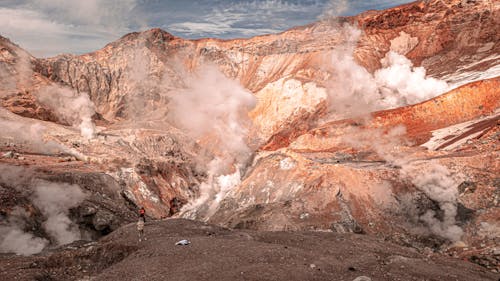 Hikers Standing by Volcano Craters