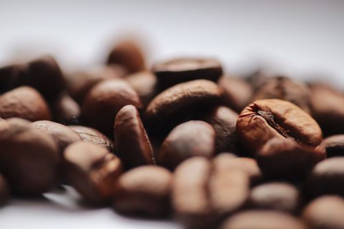 Free Detailed close-up of roasted coffee beans showcasing texture and aroma. Stock Photo