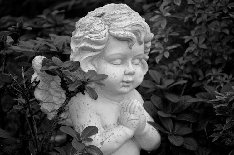 Grayscale Photo Of An Angel Statue