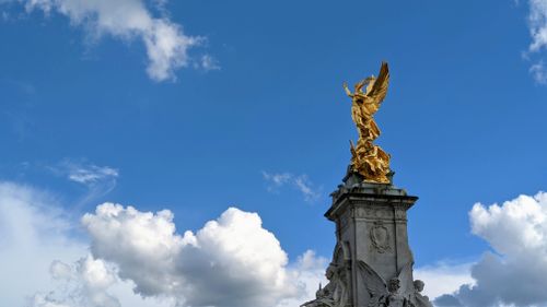 Free Stunning view of the Victoria Memorial in London against a bright blue sky. Stock Photo