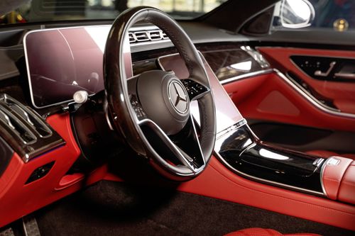 Free Close-up of a luxury Mercedes-Benz car interior with red leather seats in Dubai. Stock Photo