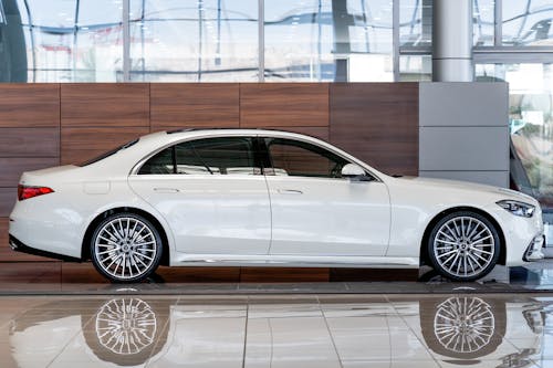 White Mercedes Parked Inside a Garage