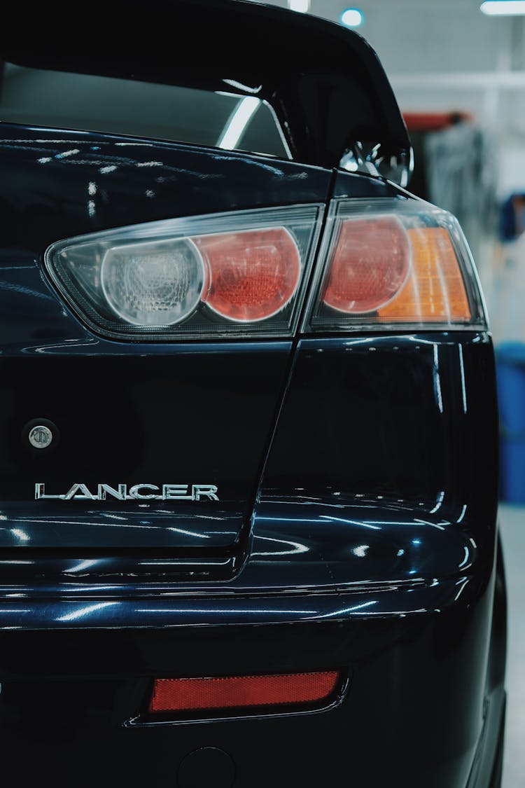 Back Lights Of A Black Lancer Car 