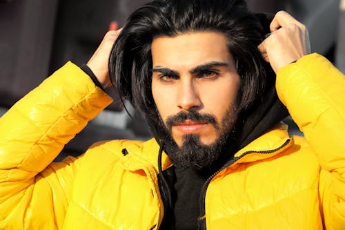 A Man in Yellow Jacket in Close-Up Photography