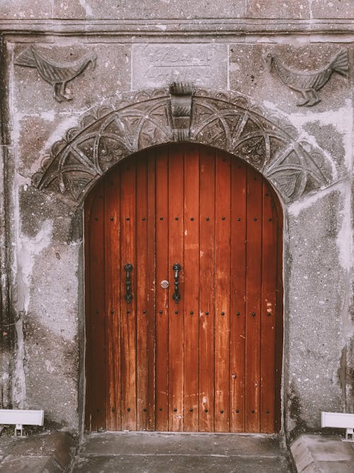 Free Brown Wooden Door of an Arched Doorway Stock Photo