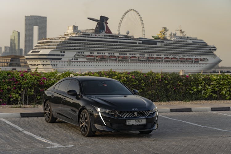 Black Peugeot Car On Parking Lot