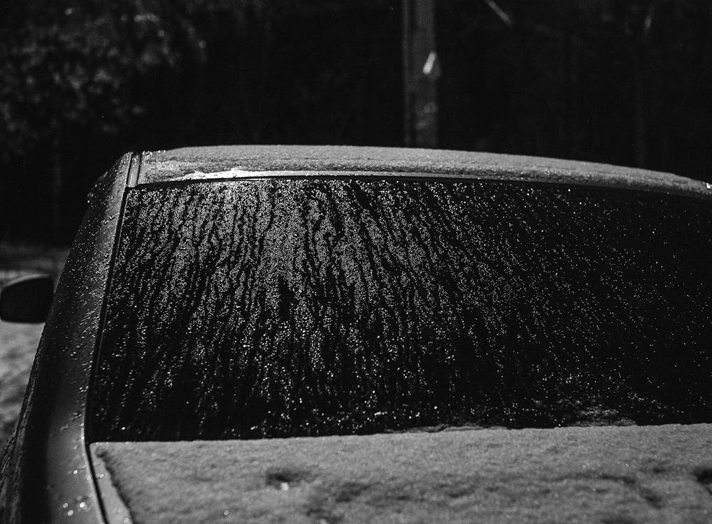 Rain and Snow Dumped on a Parked Car
