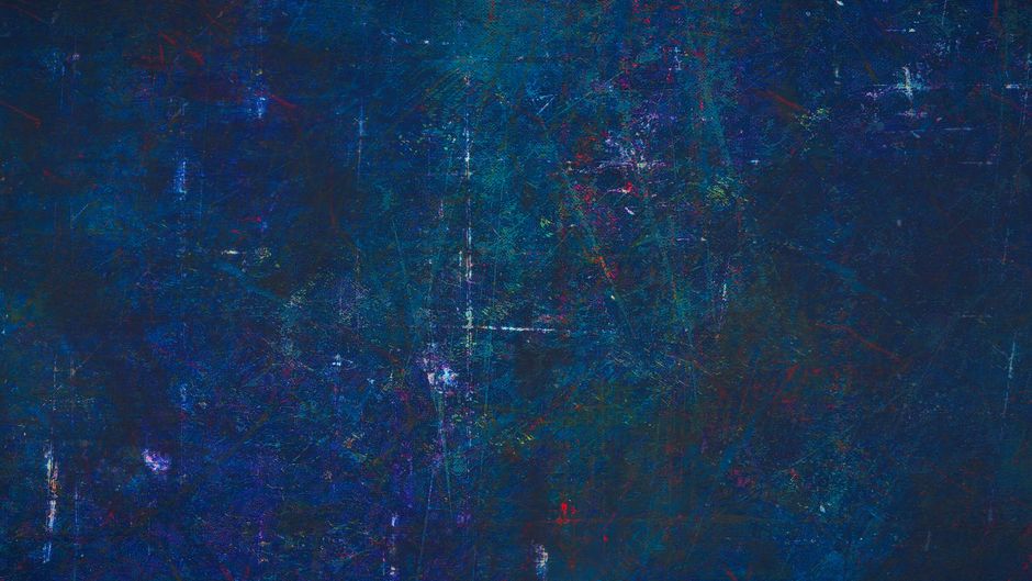 A close-up of a textured blue wall with scratches and rough surface, ideal for design use.