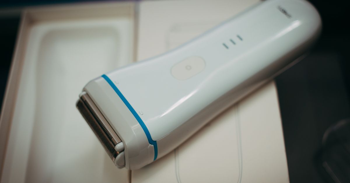 White Electric Razor A White and Blue Electric Shaver on Box · Free Stock Photo