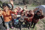 Group of Children Waving Together