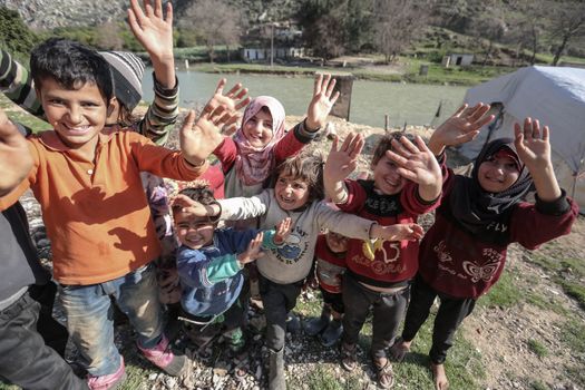 Group of Children Waving Together