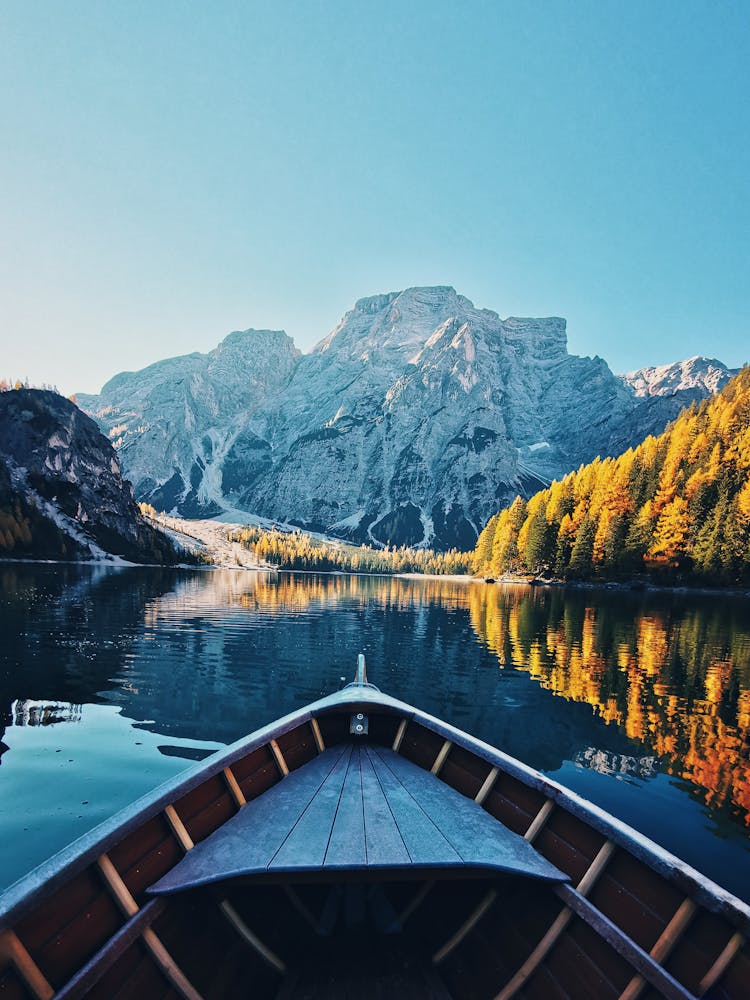 View From Boat Sailing On Lake On Beautiful Rocky Mountain Peak