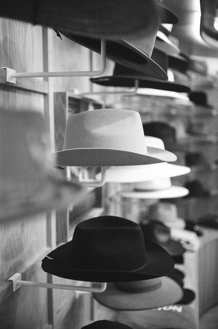 Rows of stylish wide brim hats on display at a hat store, Oceanside.