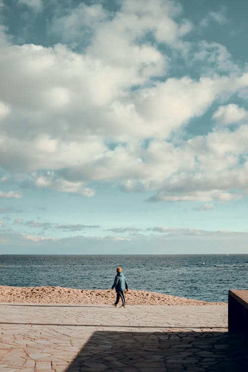 A Person Walking i the Seaside