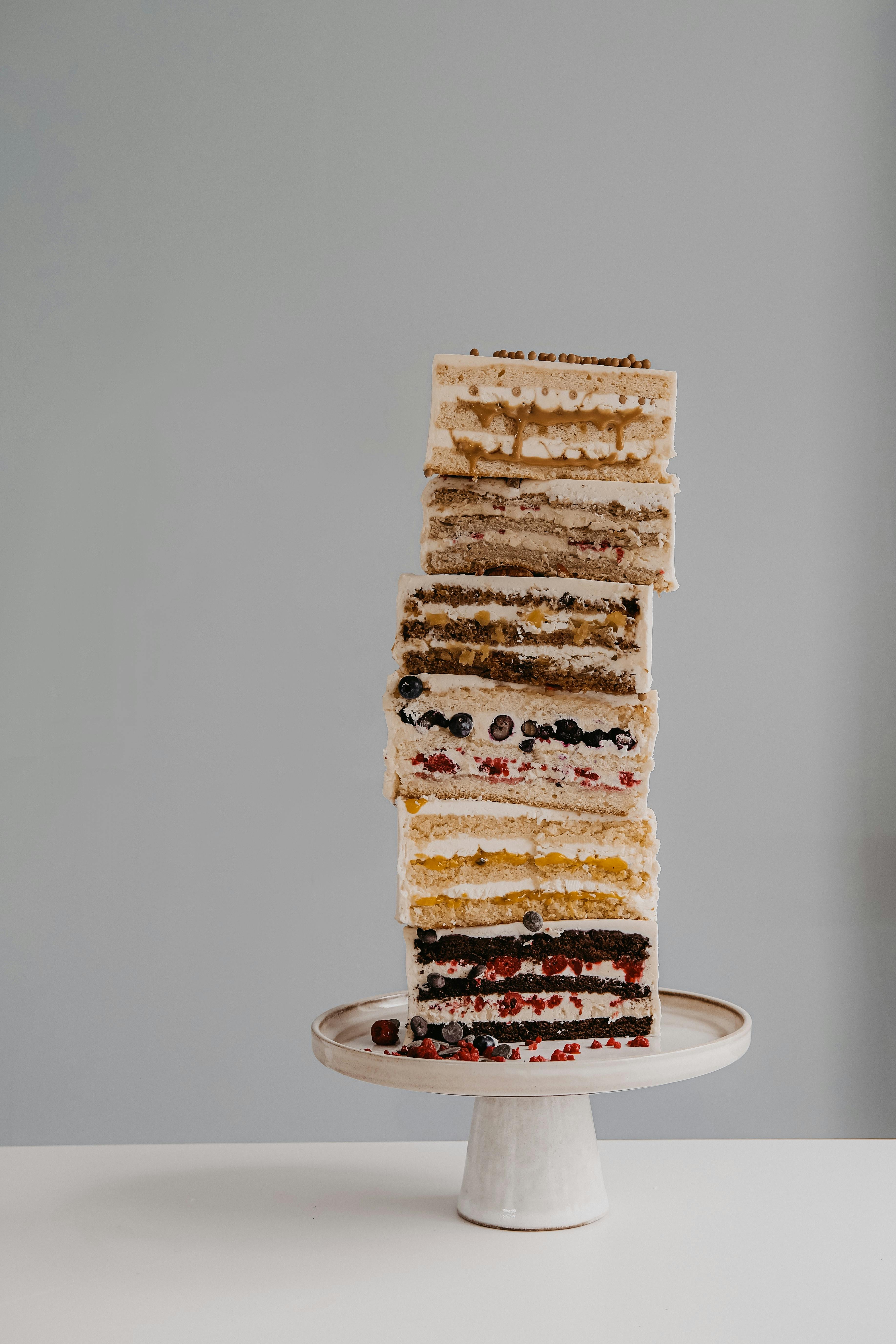 stacks of sliced cakes on a cakestand