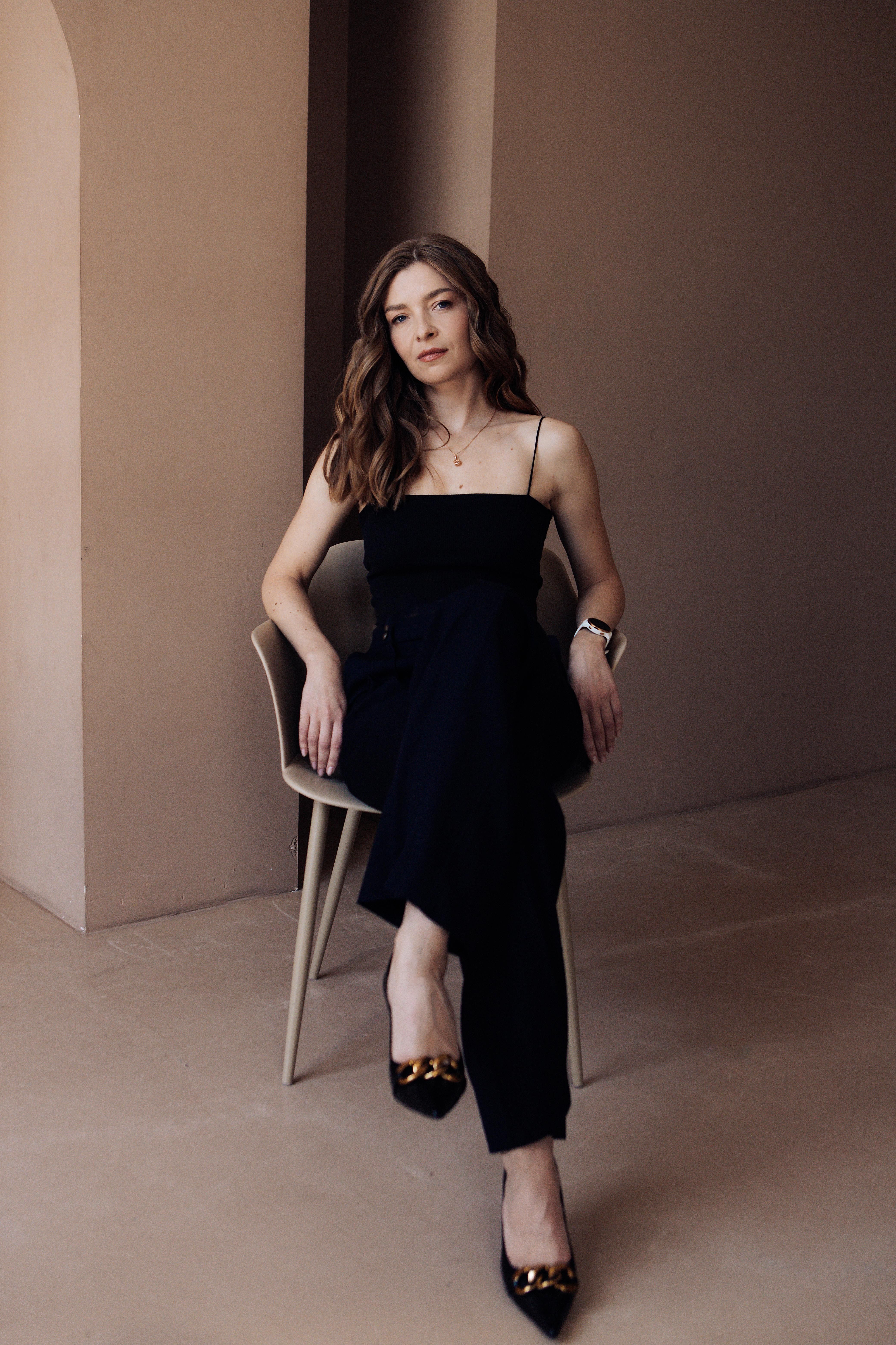 Woman in Black Outfit Sitting on a Chair · Free Stock Photo