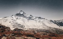 Snow Covered Mountain during Night Time