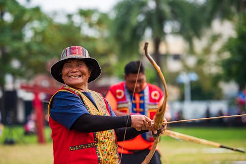 Elderly Woman Practicing Archery For Fun