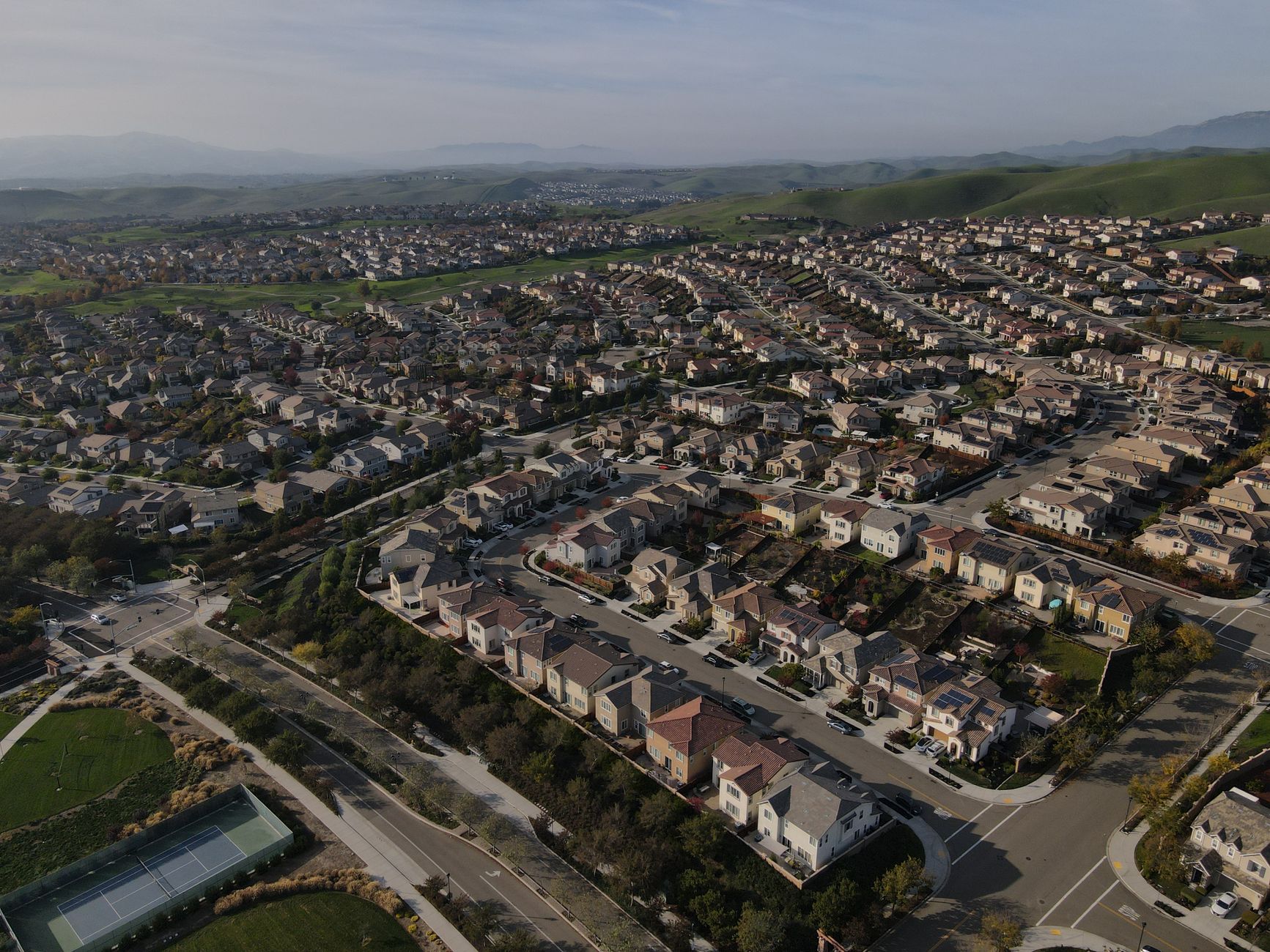 Wide aerial shot of Dublin, CA suburbs showcasing a sprawling residential landscape.