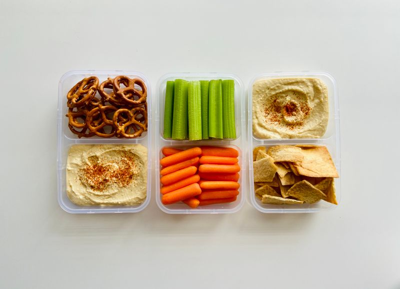 hummus snack packs with sliced vegetables