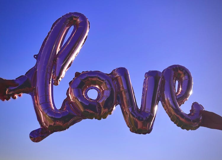 Person Holding Love Balloon 