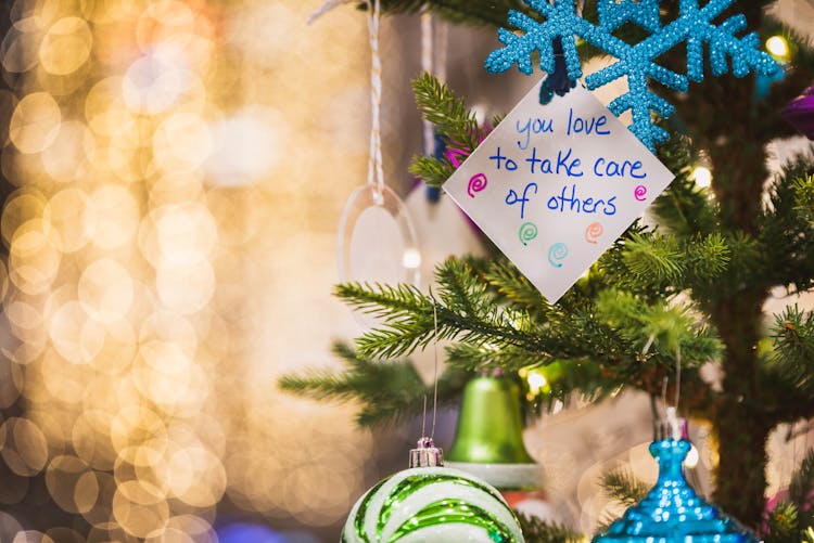 A Note Hanging On A Christmas Tree