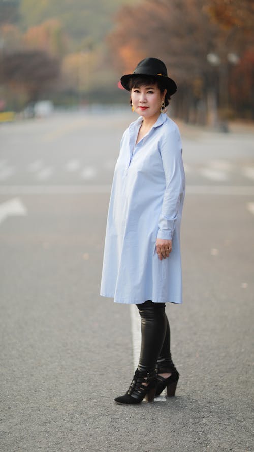 A Fashionable Woman Standing on the Road