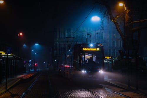 Tram Travelling the Street at Night