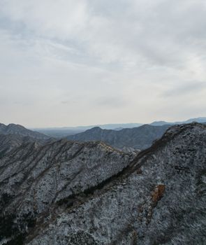 Stunning aerial view of snow-dusted mountains in Changping District, Beijing, China.
