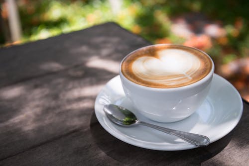 Free White Ceramic Cup Filled With Latte Stock Photo