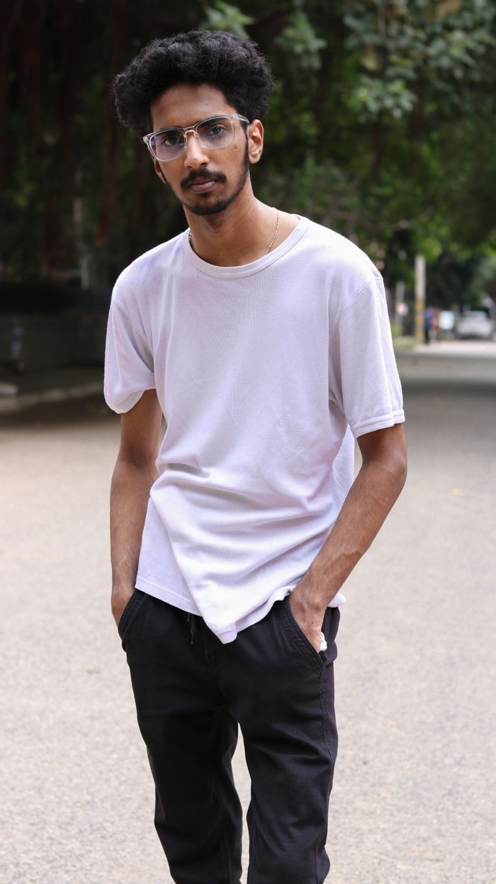 Man wearing a plain white tee — photo by Harish .P on Pexels