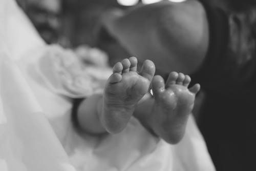 Grayscale Photo of Baby's Feet
