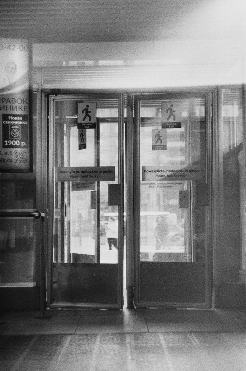 Free Black and white image of double doors showcasing a minimalist architectural style. Stock Photo