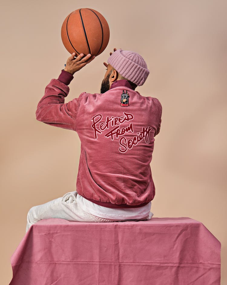 Man In Pink Clothes With Basketball