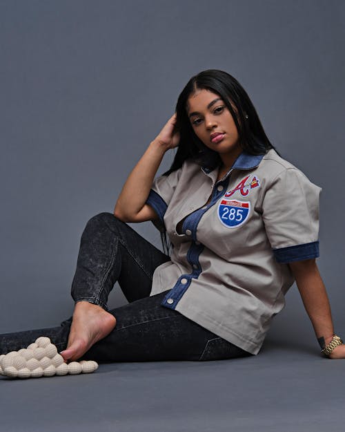 Woman in Button Down Shirt Sitting on the Floor