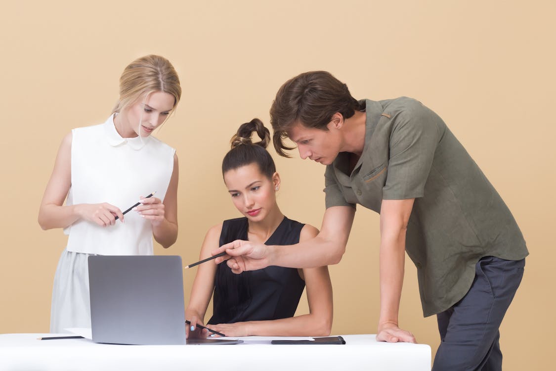 Free Colleagues Looking at Laptop Stock Photo