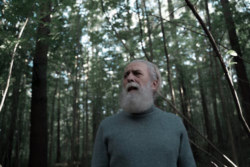 Close-Up Shot of an Elderly Man Lost in the Woods
