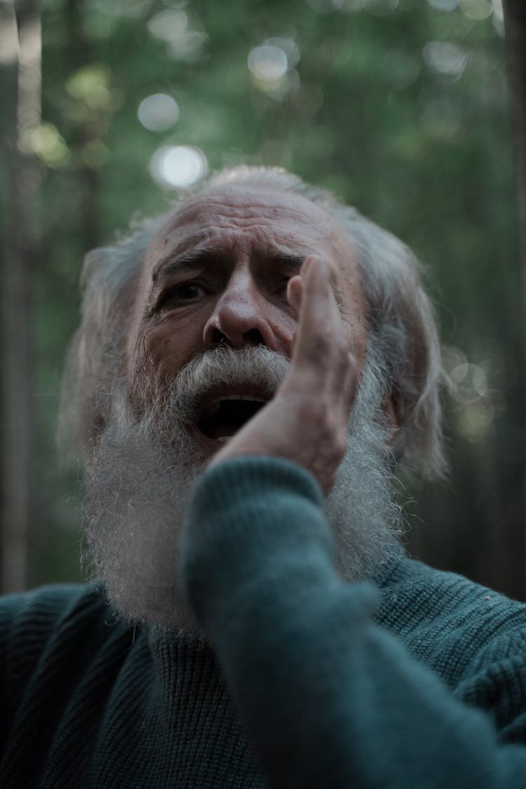 A Man In Gray Sweater Shouting