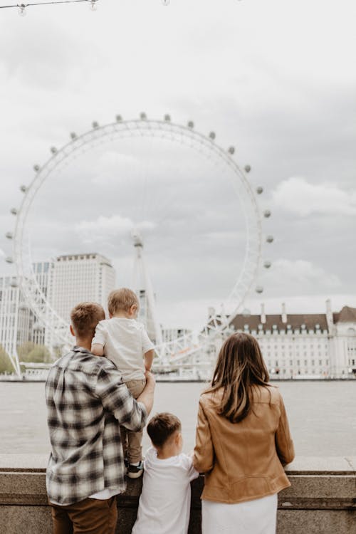 Family Looking at London Eye in London, UK